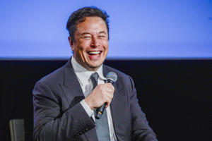 Tesla CEO Elon Musk now officially owns Twitter after trying to walk out of a $44 billion deal. Above, Musk smiles as he talks to guests at the Offshore Northern Seas 2022 (ONS) meeting in Stavanger, Norway, August 29, 2022 -- The meeting, which will take place in Stavanger from August 29 to September 1, 2022, will present the latest developments in Norway and international refers to the energy, oil and gas sectors.