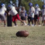 A high school football team practices Wednesday, Sept. 28, 2022, in Oklahoma City. Oklahoma has passed a new law that prohibits elementary, middle, high school and college athletes from competing on sports teams of their gender identity if they are different from their birth gender. While more than a dozen other states have similar laws, Oklahoma is the only known state that requires "biological proof of sex" to participate. (AP Photo/Sue Agrotsky)