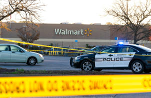 Police officers work at the site of a mass shooting at Walmart in Chesapeake, Virginia on Wednesday, November 23, 2022. The store was packed Tuesday night as people stocked up ahead of Thanksgiving.