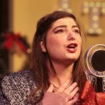 Tiara Hare rehearses for a World War II Radio Christmas show at the Theater at the Grove in Forest Grove.