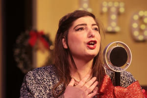 Tiara Hare rehearses for a World War II Radio Christmas show at the Theater at the Grove in Forest Grove.