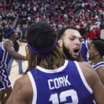 Xavier Cork (12) and Jacoby Coles (21) of TCU celebrate victory over Texas Tech after an NCAA college basketball game on Saturday, Feb. 25, 2023 in Lubbock, Texas. (AP Photo/Chase Seabolt)