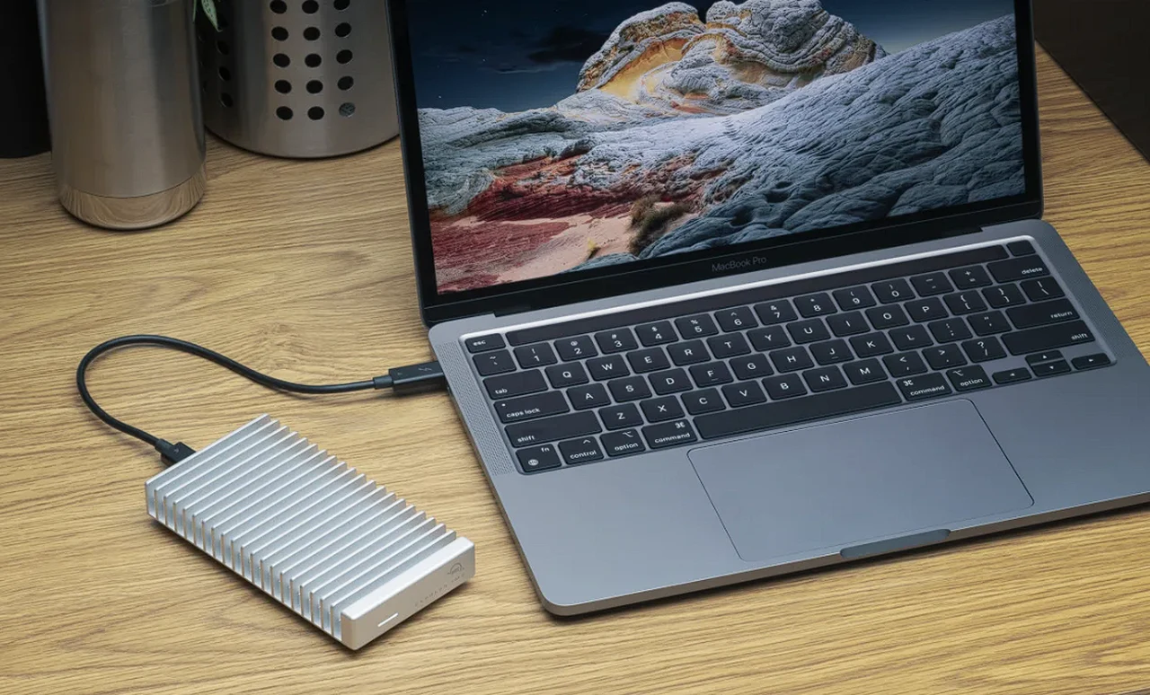 portable SSD enclosure connected to a MacBook Pro